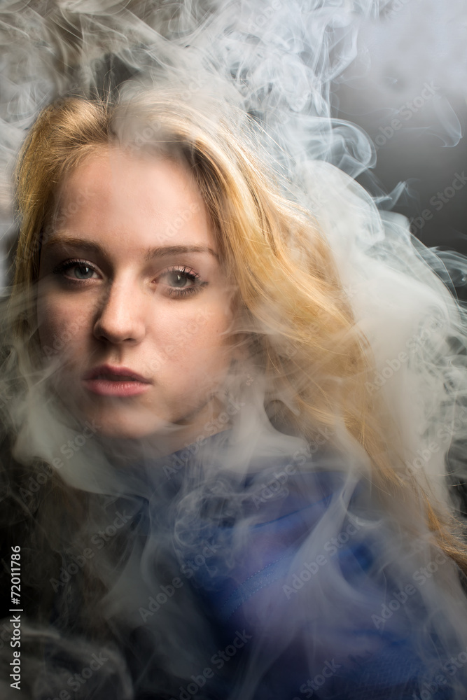 Portrait of the girl with a smoke