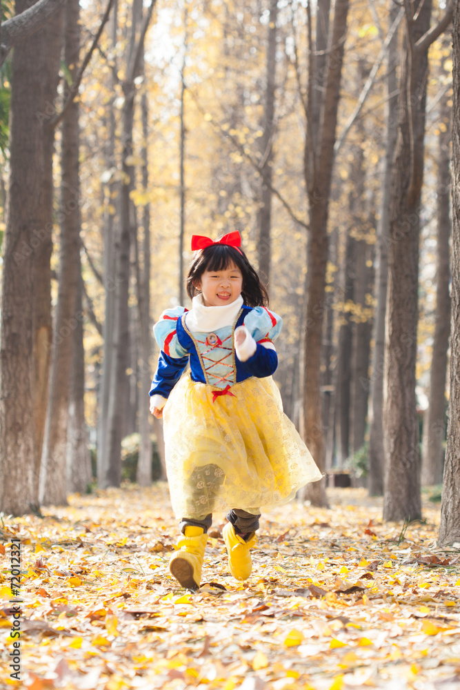 little girl dress in snow white costume in forest little girl dress in snow white costume in forest