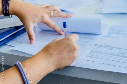 Woman signs a purchase document