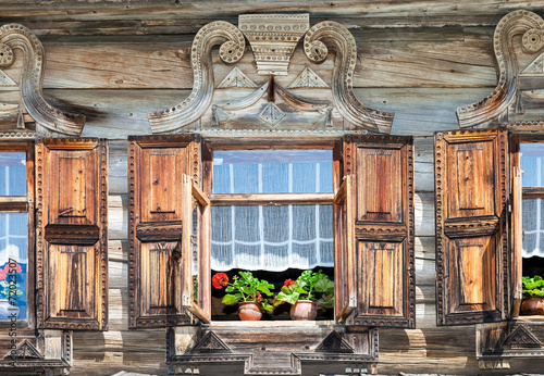 Windows on the facade of the wooden house. Old Russian country s #72023507