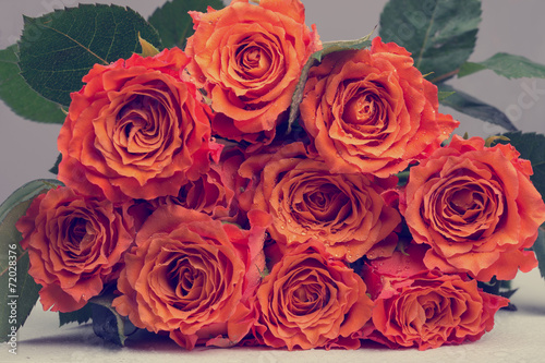 Bunch of Orange Roses Flower with Green Leaves
