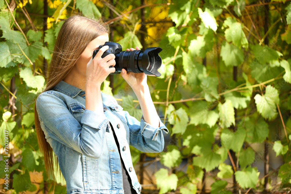 Beautiful young photography take photos outdoors in park Beautiful young photography take photos outdoors in park
