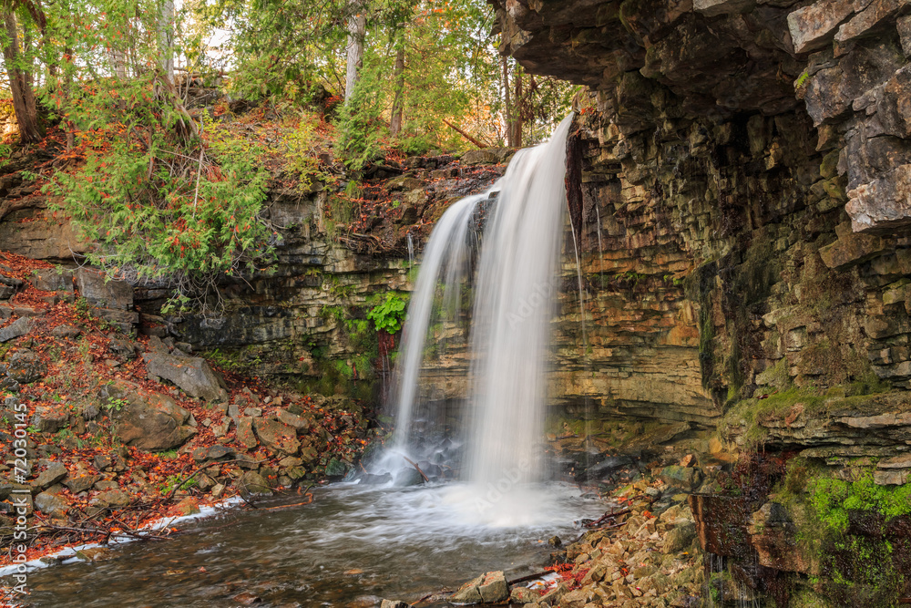 natural view of Niagara escarpment waterfall in autumn  woods