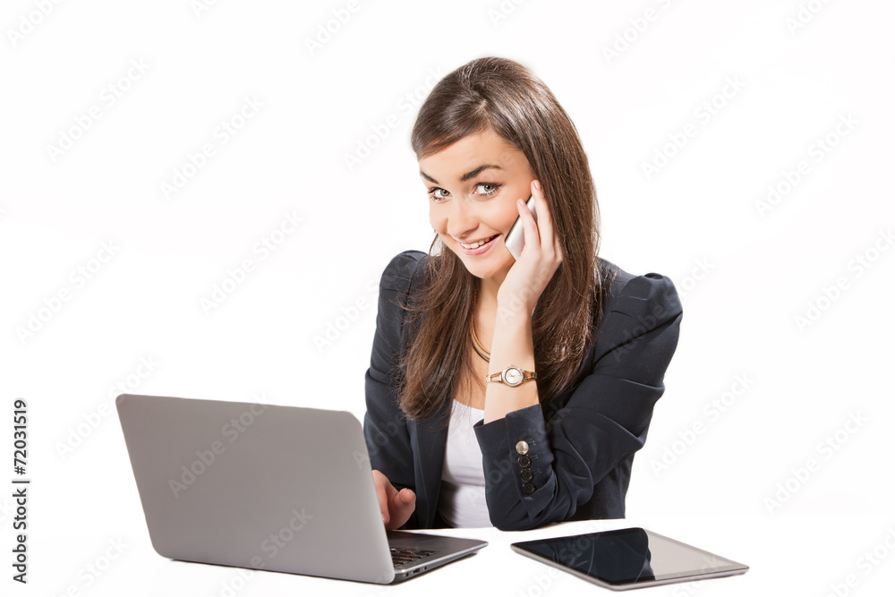 Young business woman working on laptop. Young business woman working on laptop.