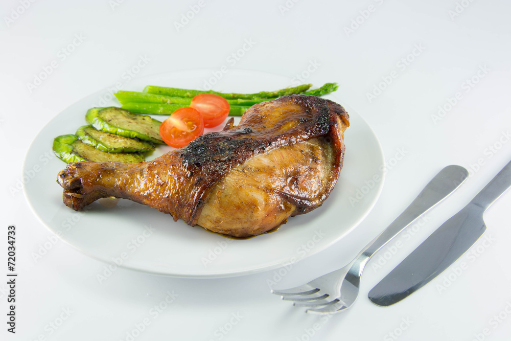 Closeup of roast chicken and vegetables