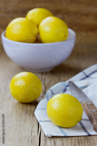 Lemons on a wooden rustic background