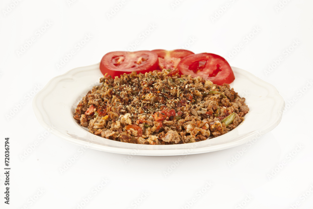 Turkish Kokorec - lamb intestine food portion white background Turkish Kokorec - lamb intestine food portion white background