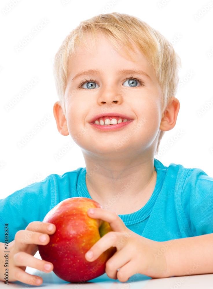 Portrait of a cute little boy with red apple Portrait of a cute little boy with red apple