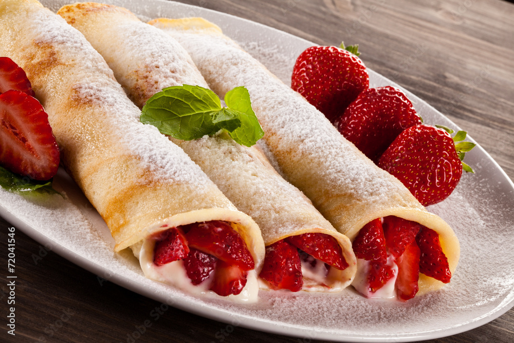 Pancakes with cream and strawberries Pancakes with cream and strawberries
