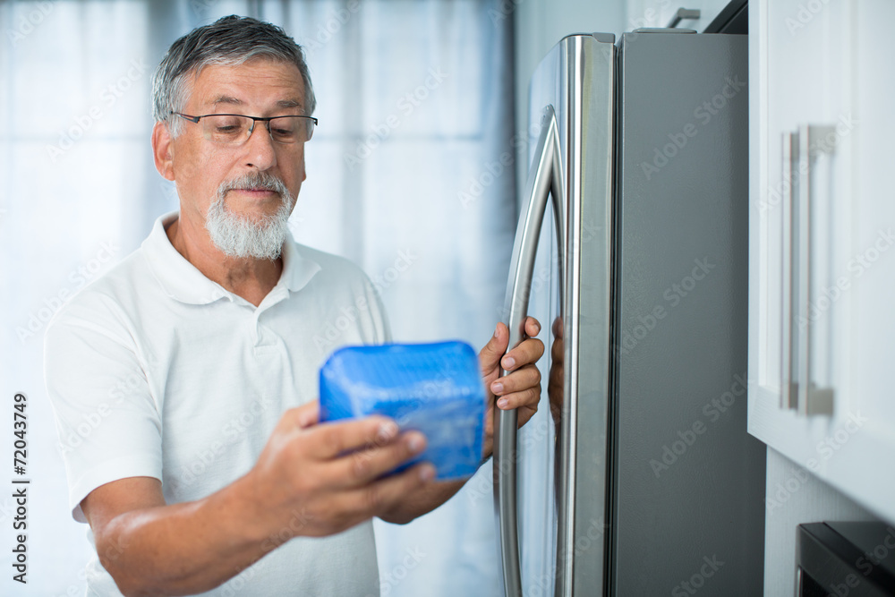 Is this still fine? Senior man in his kitchen by the fridge