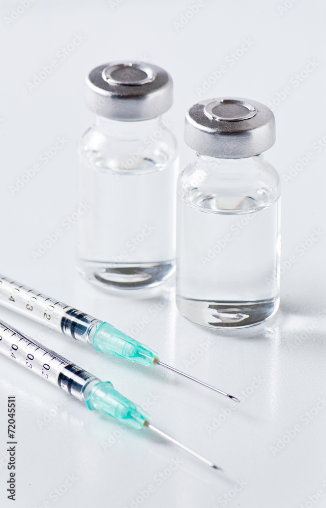 medical ampoules and syringe on white background medical ampoules and syringe on white background
