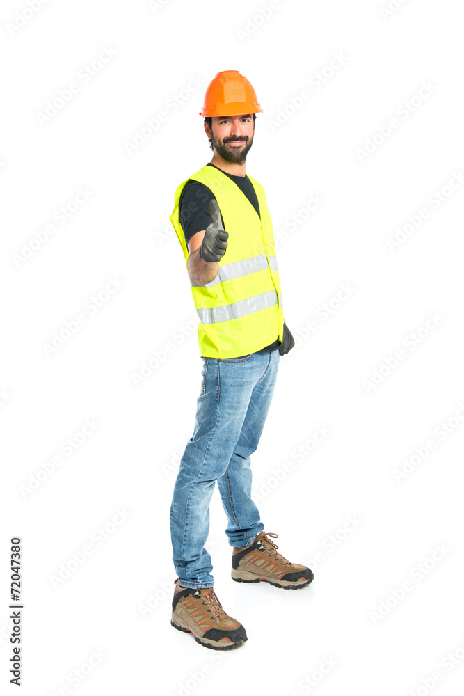 Workman with thumb up over white background Workman with thumb up over white background