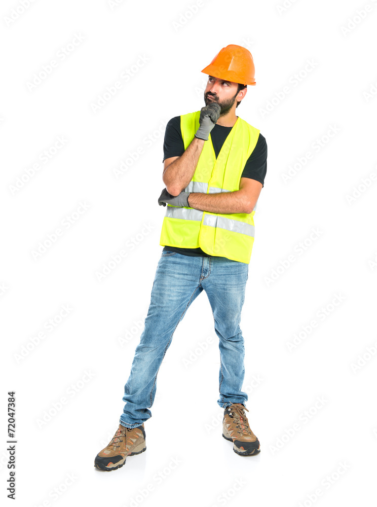 Workman thinking over isolated white background Workman thinking over isolated white background