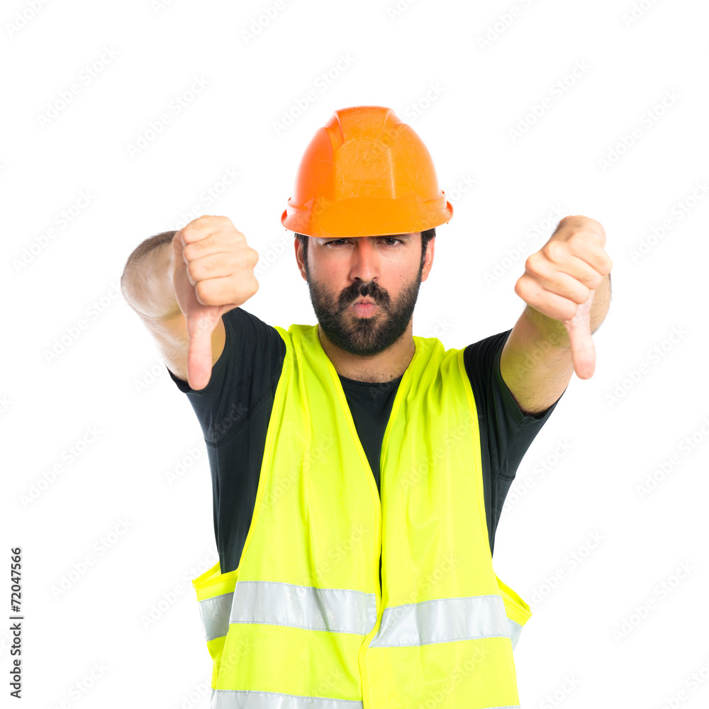 Workman doing a bad signal over white background Workman doing a bad signal over white background