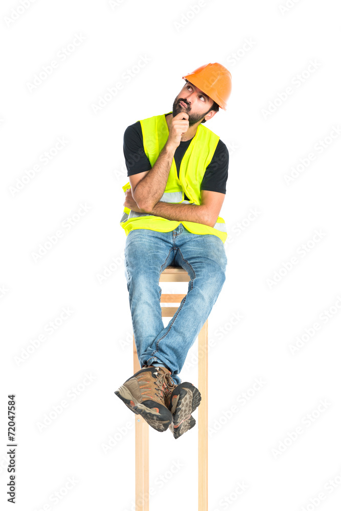 Workman thinking over isolated white background Workman thinking over isolated white background