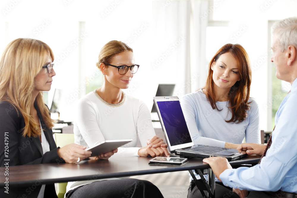 Teamwork with laptop at office Teamwork with laptop at office