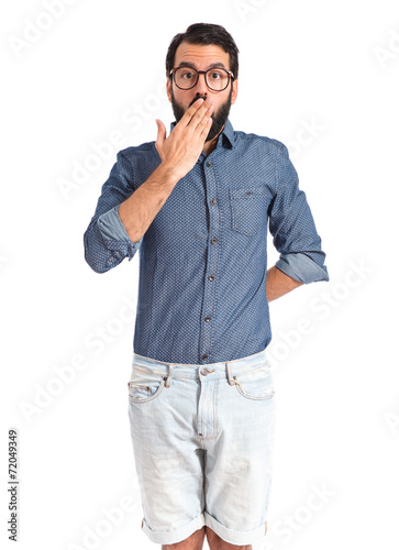 Young hipster man doing surprise gesture