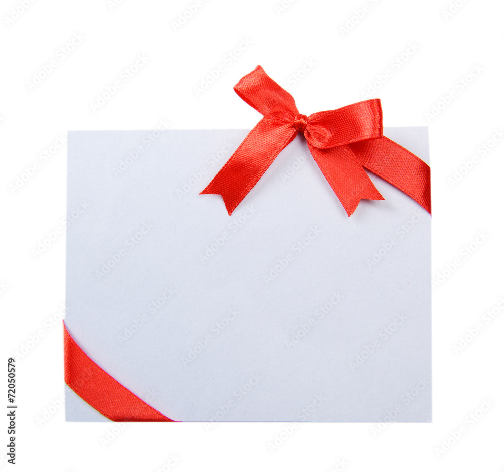 Shiny red ribbon with card isolated on white Shiny red ribbon with card isolated on white