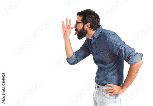 Young hipster man making a joke