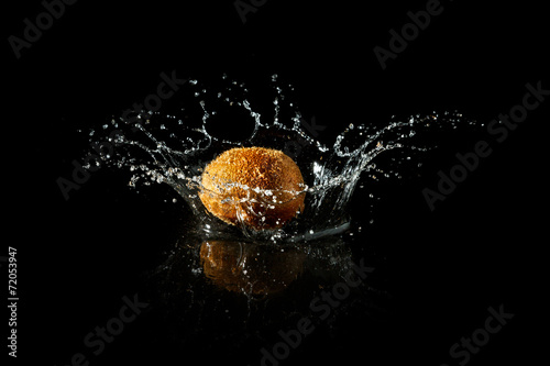 Kiwi splash on black background