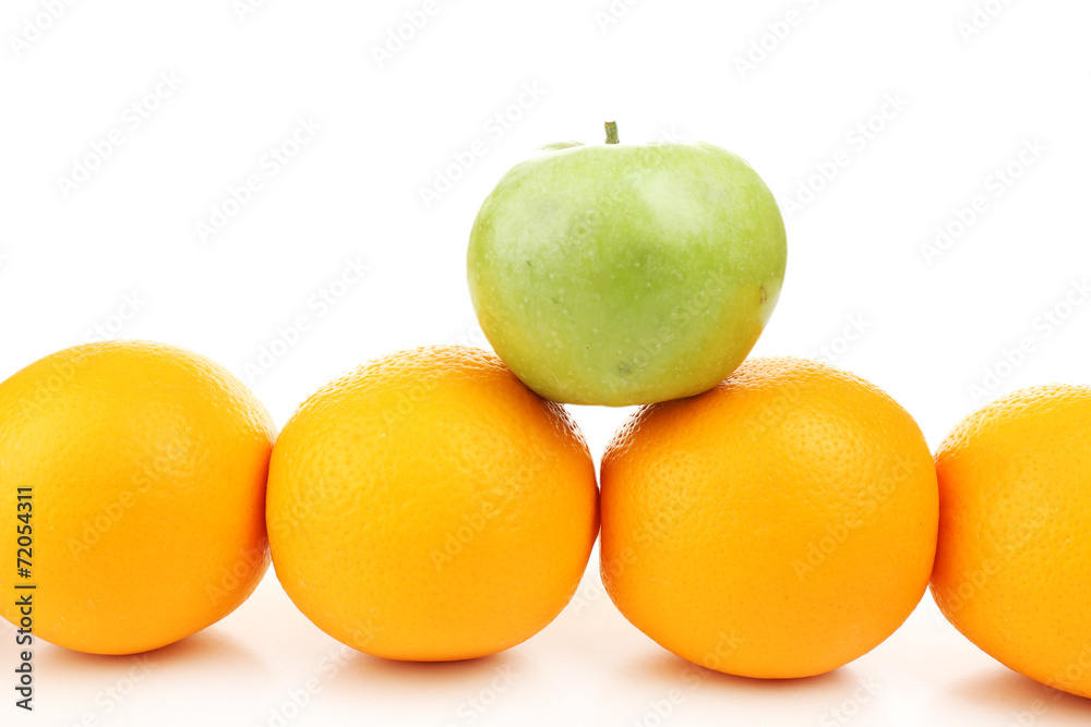 Juicy oranges and green apple, isolated on white Juicy oranges and green apple, isolated on white