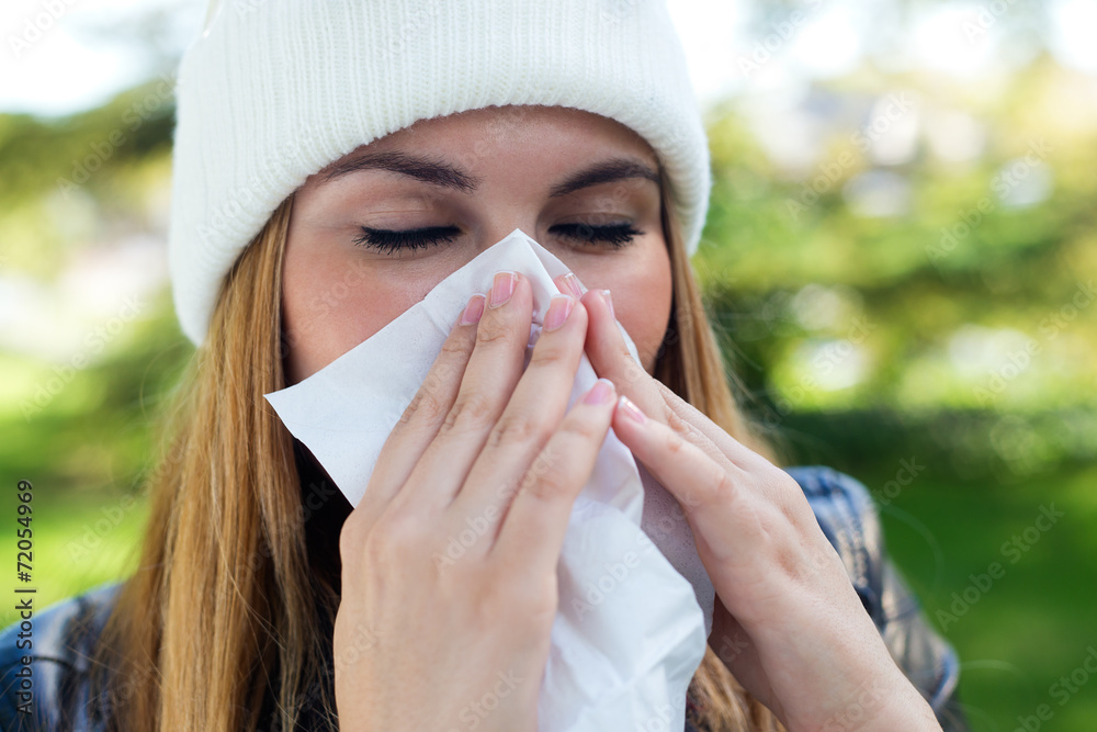 Portrait of beautiful girl with tissue having flu or allergy. Portrait of beautiful girl with tissue having flu or allergy.