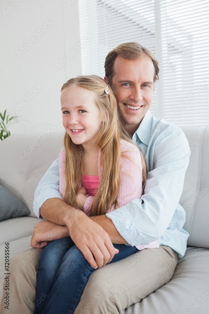 Casual father and daughter on the couch