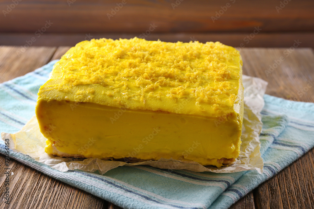 Tasty lemon cake on wooden table Tasty lemon cake on wooden table