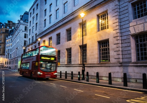 Bus on a streets of London at dusk