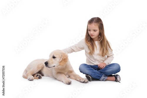 Girl holding her puppy close