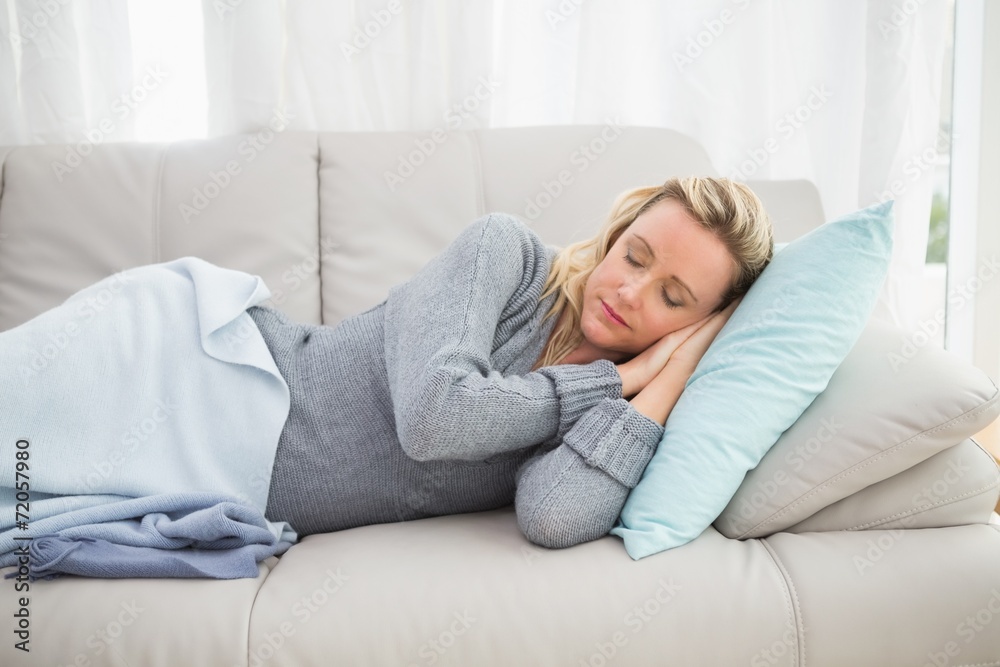 Casual pretty blonde lying on couch sleeping Casual pretty blonde lying on couch sleeping
