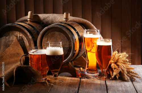 Beer barrel with beer glasses on table on wooden background #72058335