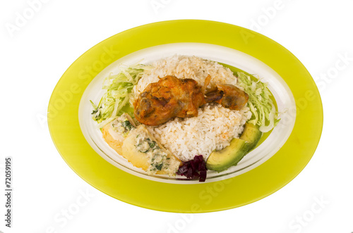 chicken served with white rice potato on a plate