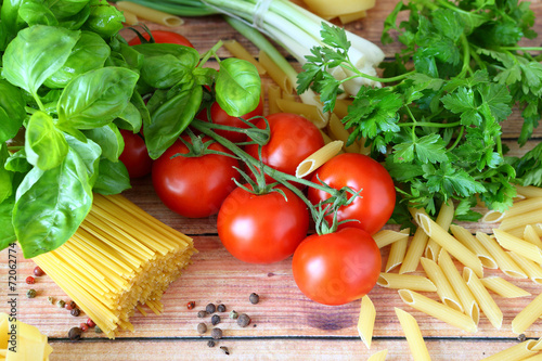 uncooked pasta and fresh vegetables