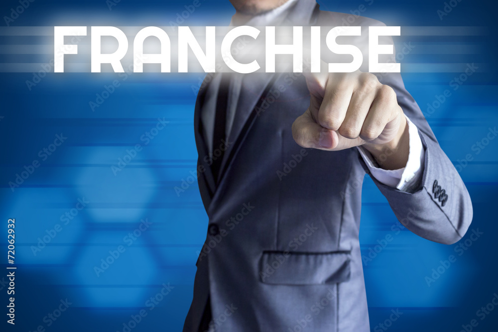 Business man touch modern interface for Franchise concept on blu Business man touch modern interface for Franchise concept on blu