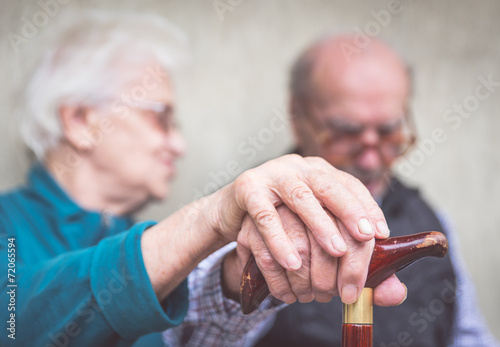 old couple holding hands photo