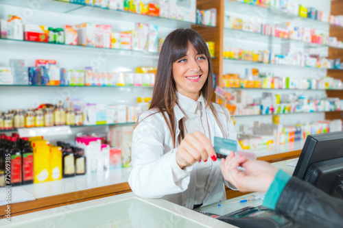 Fotografie Pharmacist suggesting medical drug to buyer in pharmacy drugstor