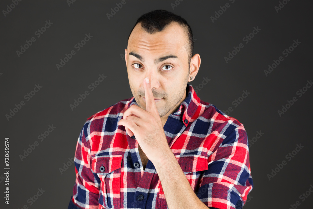 model isolated with finger on lips secret model isolated with finger on lips secret