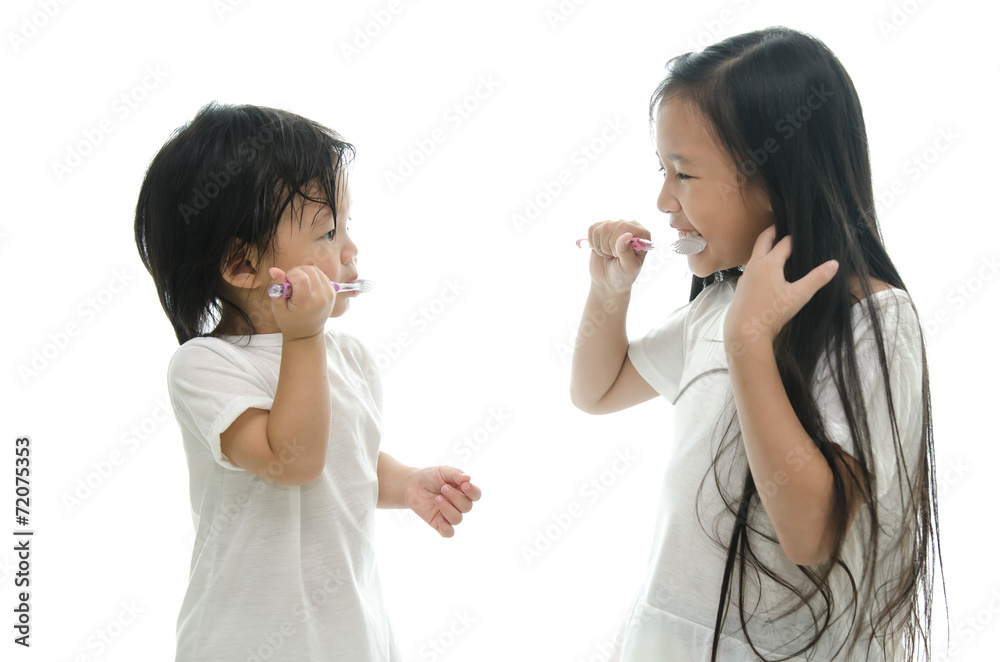 Little asian girl and boy brushing teeth Little asian girl and boy brushing teeth