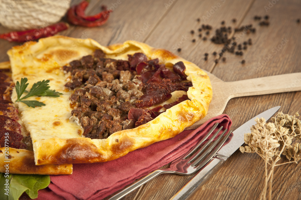 Turkish meal pizza pide stuffed with meat, cheese, pastirma Turkish meal pizza pide stuffed with meat, cheese, pastirma