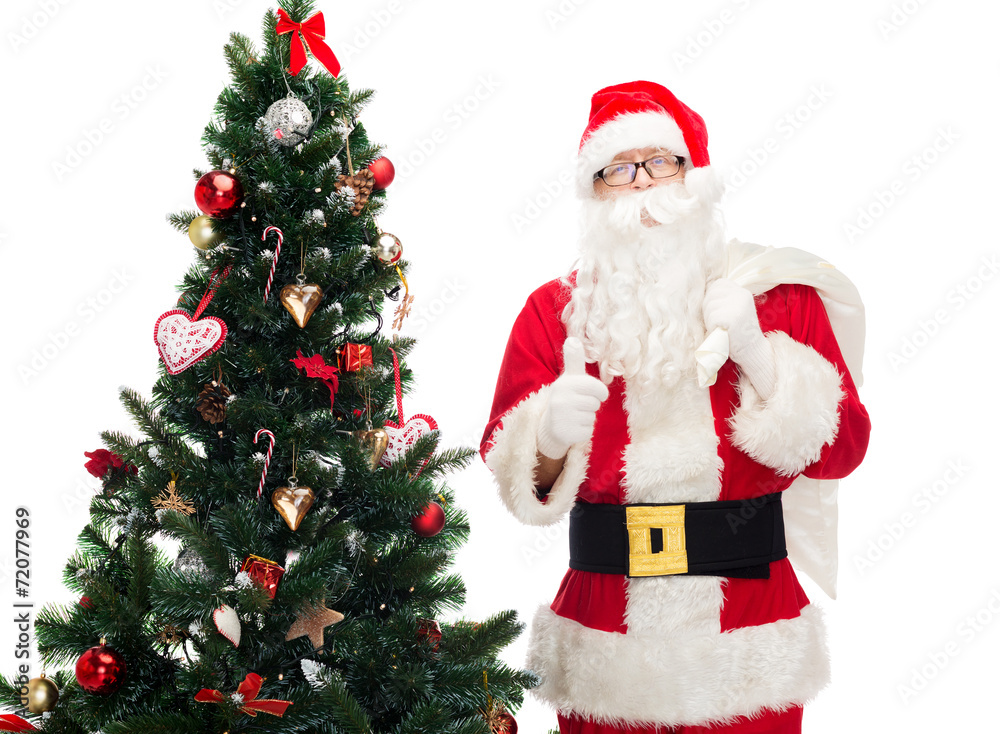 santa claus with bag and christmas tree santa claus with bag and christmas tree