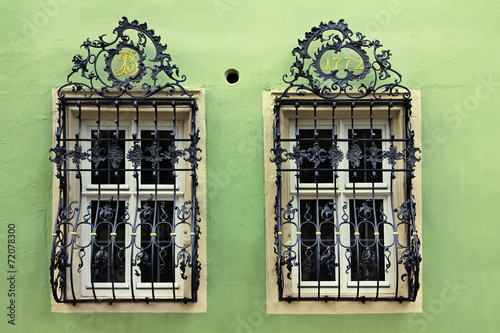 Принти на полотні Windows with a beautiful curved black metal lattices, Germany
