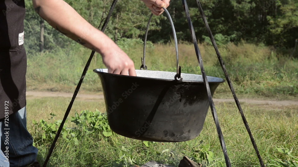 Cooking stew at the camp Cooking stew at the camp