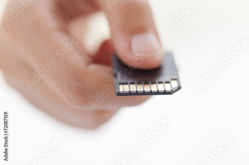 Hand with SD card connection concept photo