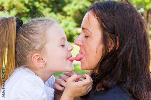 Kissing mother and daughter