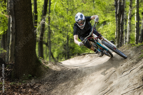 Mountainbiker riding on a path photo
