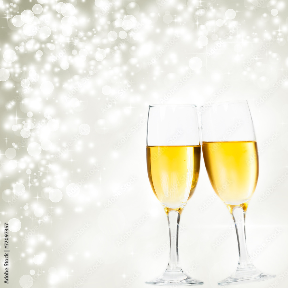 Champagne glasses against holiday lights Champagne glasses against holiday lights
