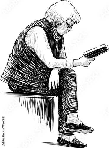 elderly woman reads the book