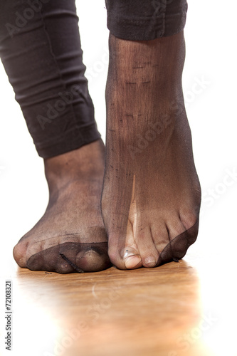 woman foot with torn stockings