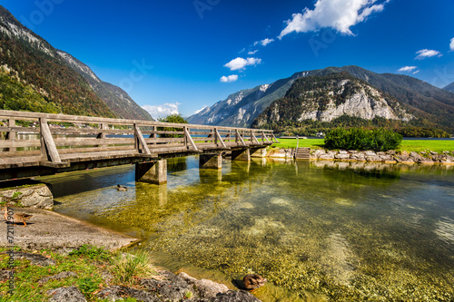 Wooden bridge over the rive...